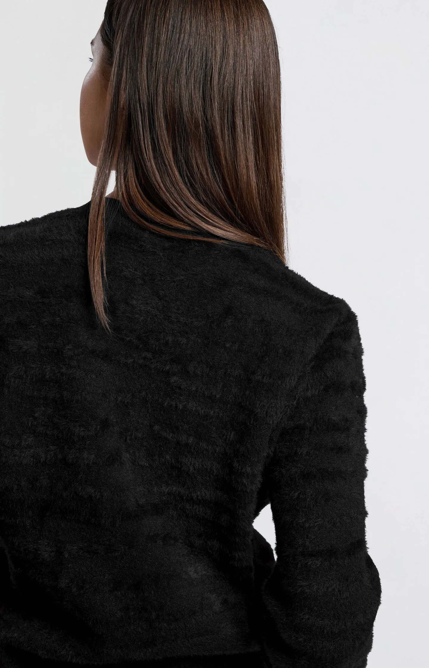 Fluffy sweater with round neckline and subtle stripes